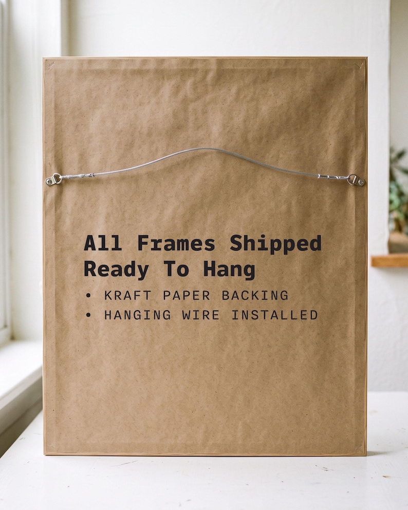 May include: A rectangular picture frame backing made of brown kraft paper. The text reads: All Frames Shipped Ready To Hang, KRAFT PAPER BACKING, HANGING WIRE INSTALLED. A silver metal hanging wire is attached to the top section of the frame.