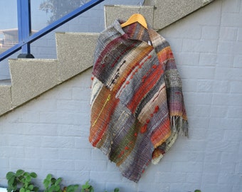 Unique artisan saori hand woven large gender neutral  poncho.  Warm and cosy merino, silk, cotton hand woven poncho. Winter weight poncho.