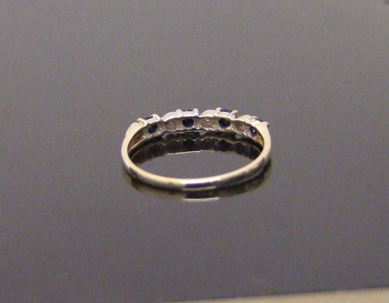 9 Carat hallmarked gold sapphire and diamond ring Size UK L 12 USA 6
