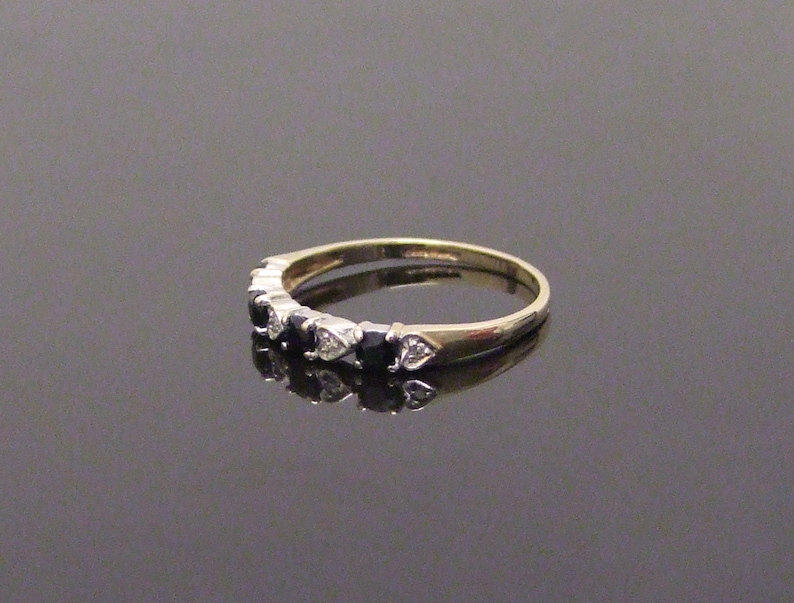 9 Carat hallmarked gold sapphire and diamond ring Size UK L 12 USA 6