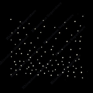 May include: A black background with a scattered pattern of small, white rhinestones.