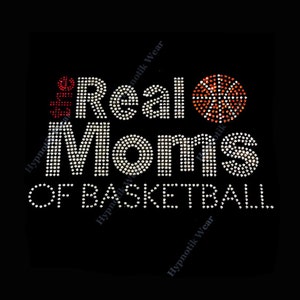 May include: Black graphic design with the text "The Real Moms of Basketball" in white rhinestones. A basketball made of orange rhinestones is on the right. The word "the" is in red rhinestones.