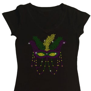 May include: Black t-shirt with a purple, green, and gold rhinestone Mardi Gras mask design.