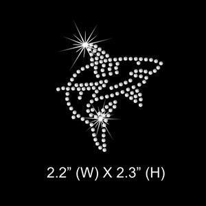 May include: A white rhinestone design of a shark, measuring 2.2 inches wide by 2.3 inches high.