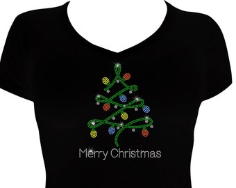 May include: Black t-shirt with a green Christmas tree design featuring colorful lights and the text "Merry Christmas".