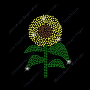 May include: A yellow and green rhinestone sunflower with a brown center. The sunflower is made of small rhinestones and is perfect for adding a touch of sparkle to any project.