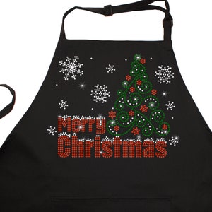 May include: Black Christmas apron with a green and red sparkly Christmas tree and the words "Merry Christmas" in red sparkly letters.