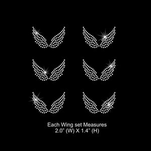May include: Six sets of rhinestone angel wings, each measuring 2 inches wide by 1.4 inches high.