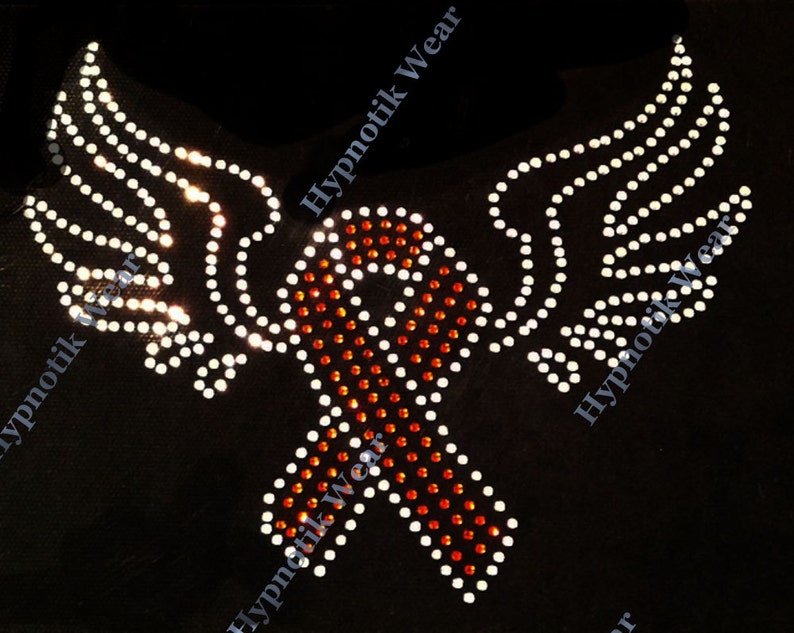 May include: A red and orange ribbon with white rhinestones, surrounded by two white wings with rhinestones. The design is on a black background and says "Hypnotik Wear" on the top and bottom.