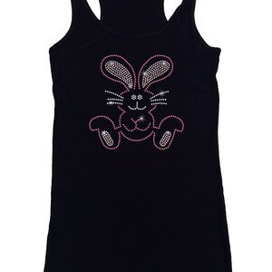 May include: Black tank top with a pink rhinestone bunny design.