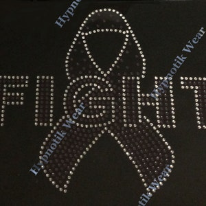 May include: A black t-shirt with a rhinestone design of a ribbon and the word "FIGHT".