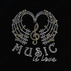 May include: A black graphic design featuring a musical treble clef and musical notes, with the word "MUSIC" and the word "Love" spelled out in white rhinestones. The design is in the shape of a heart.