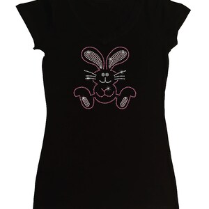 May include: Black t-shirt with a pink rhinestone bunny design.