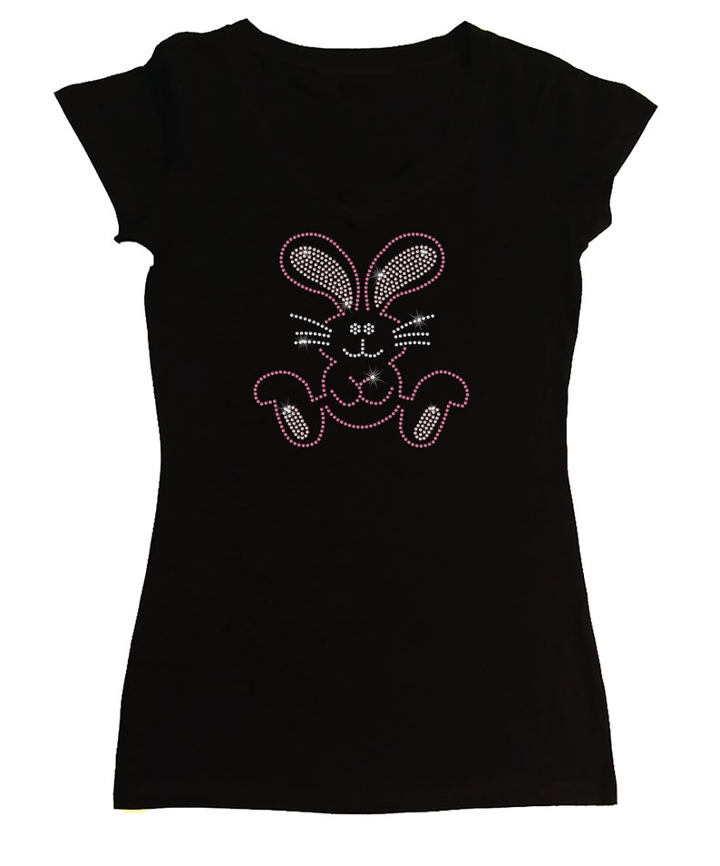 May include: Black t-shirt with a pink rhinestone bunny design.