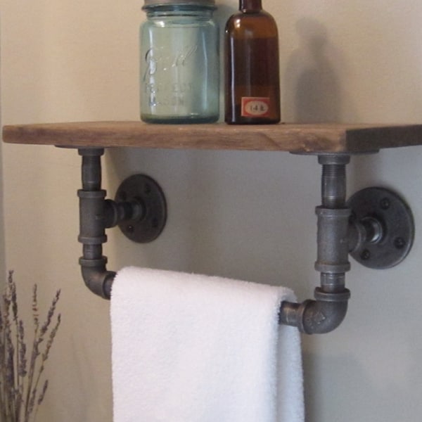 Industrial pipe hand towel rack with wood shelf.
