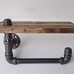 Industrial pipe single flange hand towel rack with wood shelf.