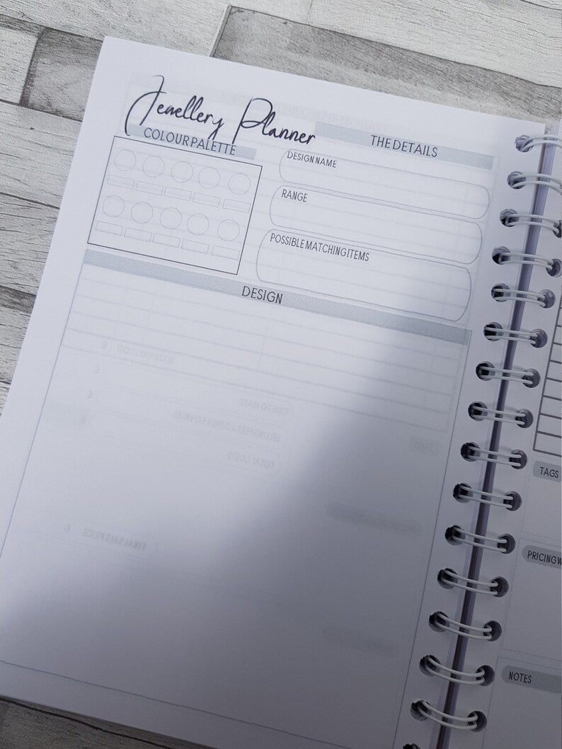 May include: A blank page from a jewelry planner with a color palette section, design details, and a design section. The page has the text "Jewelry Planner" at the top.
