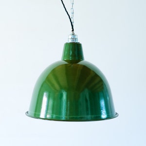 May include: A green metal pendant light with a chain and black cord hanging from the ceiling.