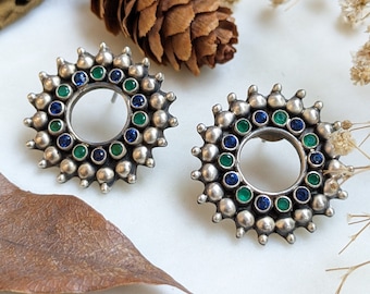 Blue and green stone studded round statement silver stud