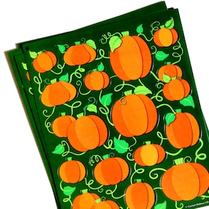 May include: A stack of dark green sheets featuring a repeating pattern of orange pumpkins with light green leaves and swirling vines. The bottom right corner of the sheets displays the printed text Carson-Dellosa CD-168025.