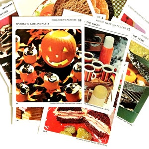 May include: A selection of vintage recipe cards from The Betty Crocker Recipe Card Library. One card shows a carved pumpkin and cupcakes for a "Spooks 'N Goblins Party." Other cards display various foods and recipes.