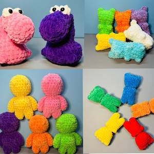 Puede incluir: Una colección de animales de peluche de crochet de colores, incluyendo osos, dinosaurios y otras criaturas. Los animales están hechos con hilo suave y peludo y tienen una variedad de colores, incluyendo rosa, morado, verde, amarillo, naranja y azul.