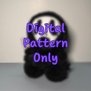 May include: A blurred black and white Scream mask design with the text "Digital Pattern Only" in purple. The image suggests a digital pattern for a Halloween or horror-themed craft project. The focus is on the text.