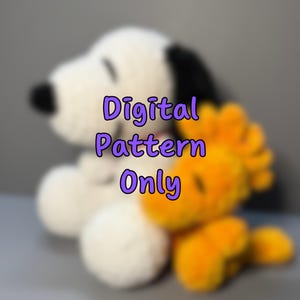 May include: A plush Snoopy toy in white with black ears and a black patch on its back, and a yellow Woodstock toy. The text "Digital Pattern Only" is written in purple.