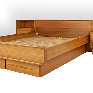 May include: A light brown wooden bed frame featuring a headboard with integrated side tables, each containing two drawers. The bed base includes two additional storage drawers at the foot, and the frame is constructed with horizontal wooden slats.