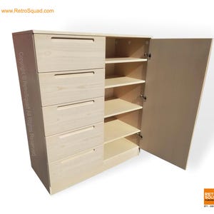 May include: A light-colored wooden cabinet with five drawers on the left and shelves on the right. The cabinet door is open, revealing the interior shelves. The cabinet has a modern design.