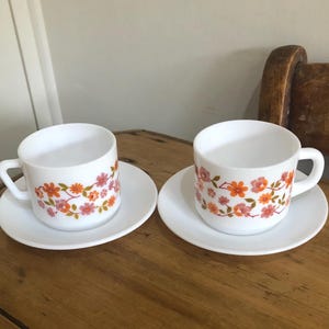 Pair of Vintage Arcopal, Scania, Floral Pattern Milk Glass Cups and Saucers