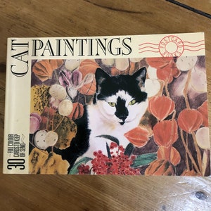 Libro di cartoline con dipinti di gatti
