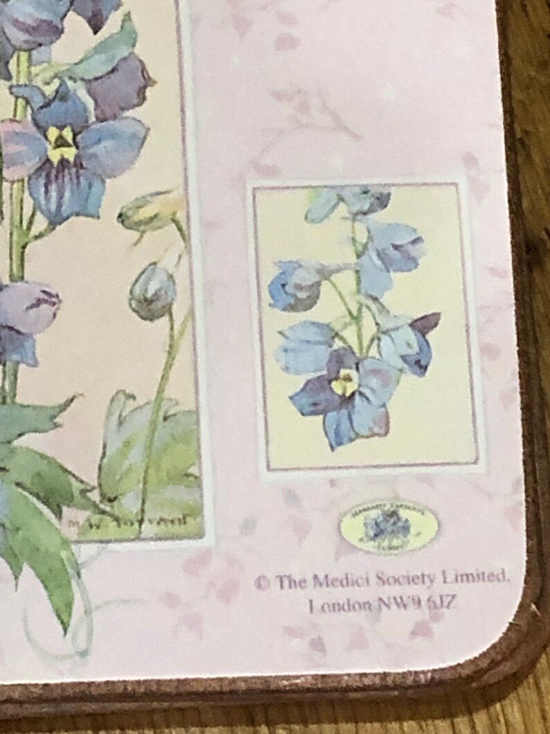 May include: A pink and white floral design with a blue flower in the center. The text "The Medici Society Limited, London NW9 6JZ" is printed at the bottom.
