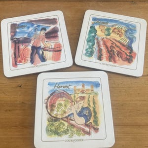 Set van drie Corvoisier-onderzetters en onderzetters