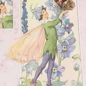 May include: A fairy with pink wings and a green dress reaches up to touch a blue flower. The fairy has a blue flower on its head and is standing on a green leaf. There is a butterfly on the flower.
