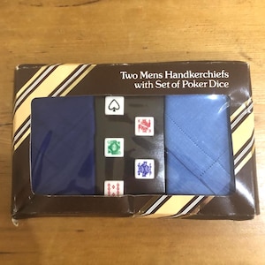 May include: A boxed set with two blue handkerchiefs and poker dice. The box has a brown and yellow striped design and the text "Two Mens Handkerchiefs with Set of Poker Dice". The dice feature card suit symbols.