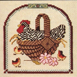 May include: A cross-stitch pattern featuring a brown and white hen sitting in a brown wicker basket with three chicks. The basket is surrounded by pink flowers and green leaves. The background is a cream color with a brown and red border.