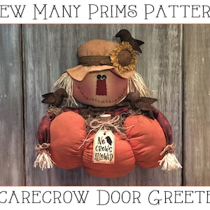 May include: A handmade scarecrow door greeter with a pumpkin body, a straw hat, and a sign that reads "No Crows Allowed".