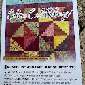 May include: Quiltworx.com Stashbuster Pattern: Cabin Cuddlebugs. This quilting pattern includes instructions for making a 32-inch by 32-inch wall hanging. The pattern requires 16 strips of fabric, each measuring 4 1/2 inches wide, and 4 strips of fabric, each measuring 2 1/2 inches wide.