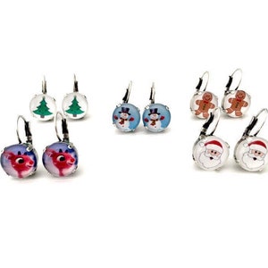 May include: Assortment of Christmas themed earrings.  The earrings are silver with a clear glass cabochon.  The designs include a Christmas tree, a snowman, a gingerbread man, Santa Claus, and a reindeer.