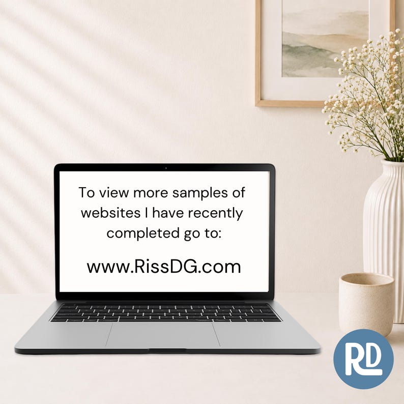 May include: A laptop computer with a black frame and keyboard displaying the text: To view more samples of websites I have recently completed go to: www.RissDG.com. The screen is white with black text, and the device is positioned on a flat surface.