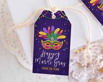 May include: Purple gift tag with a colorful Mardi Gras mask, gold stars, and the text "Happy Mardi Gras from the team".