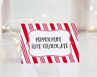 May include: White card with red and white candy cane stripes. The card has a white border and the text "Peppermint Hot Chocolate" in black.