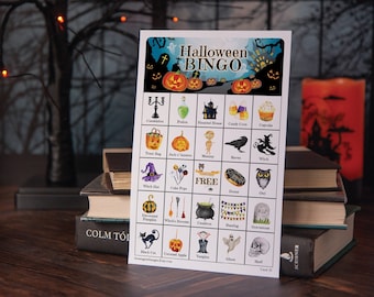 May include: A Halloween Bingo card with images of various Halloween icons, including a cauldron, a witch's hat, a black cat, a ghost, a skull, a pumpkin, a candy corn, a haunted house, a raven, a witch, an owl, a donut, a witch's broom, a vampire, a tombstone, and a decorated pumpkin. The card is printed on white paper with a blue background and the words "Halloween Bingo" in black text.