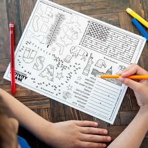 May include: A black and white printable activity page for kids featuring a connect the dots activity, a word scramble, a maze, and a coloring page. The page includes the words "United States Activity Page" and "USA".