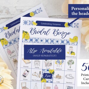 May include: A printable bridal bingo card with a blue and white tiled pattern and lemons. The card has squares with images of items commonly associated with weddings, such as a mason jar, hair products, and a cake. The text "Celebrating Vivianna Bridal Bingo" is at the top of the card. The text "Also Available (SOLD SEPARATELY)" is below the bingo card. The text "50 Printable Cards Included" is in the bottom right corner of the image.