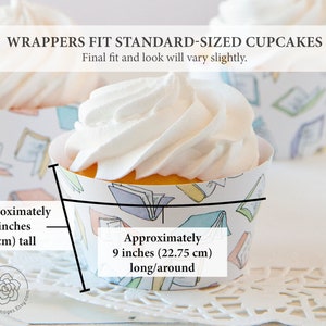 May include: White cupcake with a book-themed wrapper. The wrapper has a colorful pattern of books and is approximately 9 inches (22.75 cm) long and 1.75 inches (4.5 cm) tall.