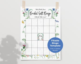 May include: A printable bridal shower game bingo card with a floral border. The card has a 5x5 grid with blank squares and a free space in the center. The text "Bridal Gift Bingo" is at the top of the card.