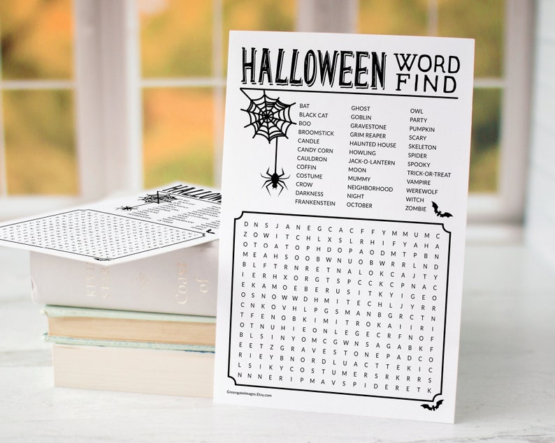 May include: A black and white Halloween word search puzzle with a spider web and spider graphic. The puzzle includes words like bat, ghost, goblin, graveyard, grim reaper, haunted house, howling, jack-o-lantern, moon, mummy, neighborhood, night, October, owl, party, pumpkin, scary, skeleton, spider, spooky, trick-or-treat, vampire, werewolf, witch, and zombie.