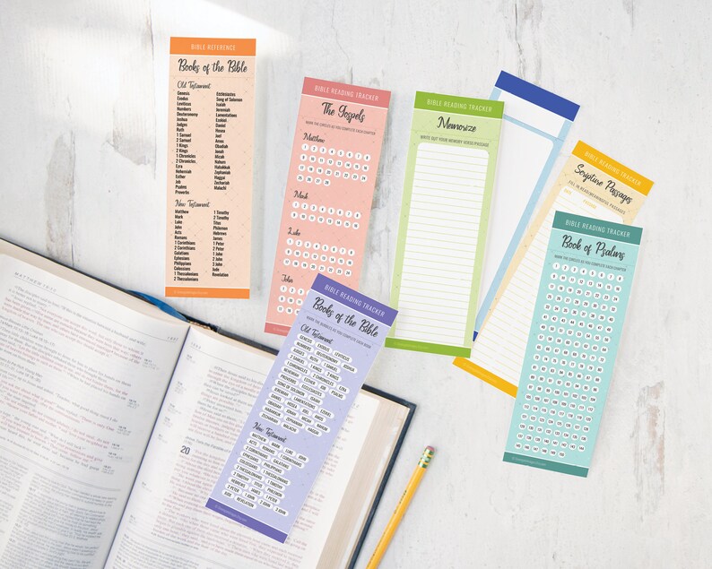 May include: A set of six colorful bookmarks with Bible reading trackers. Each bookmark features a different theme, including the Books of the Bible, the Gospels, Memory Verses, Scripture Passages, and the Book of Psalms. The bookmarks are printed on a textured paper and have a simple, modern design.